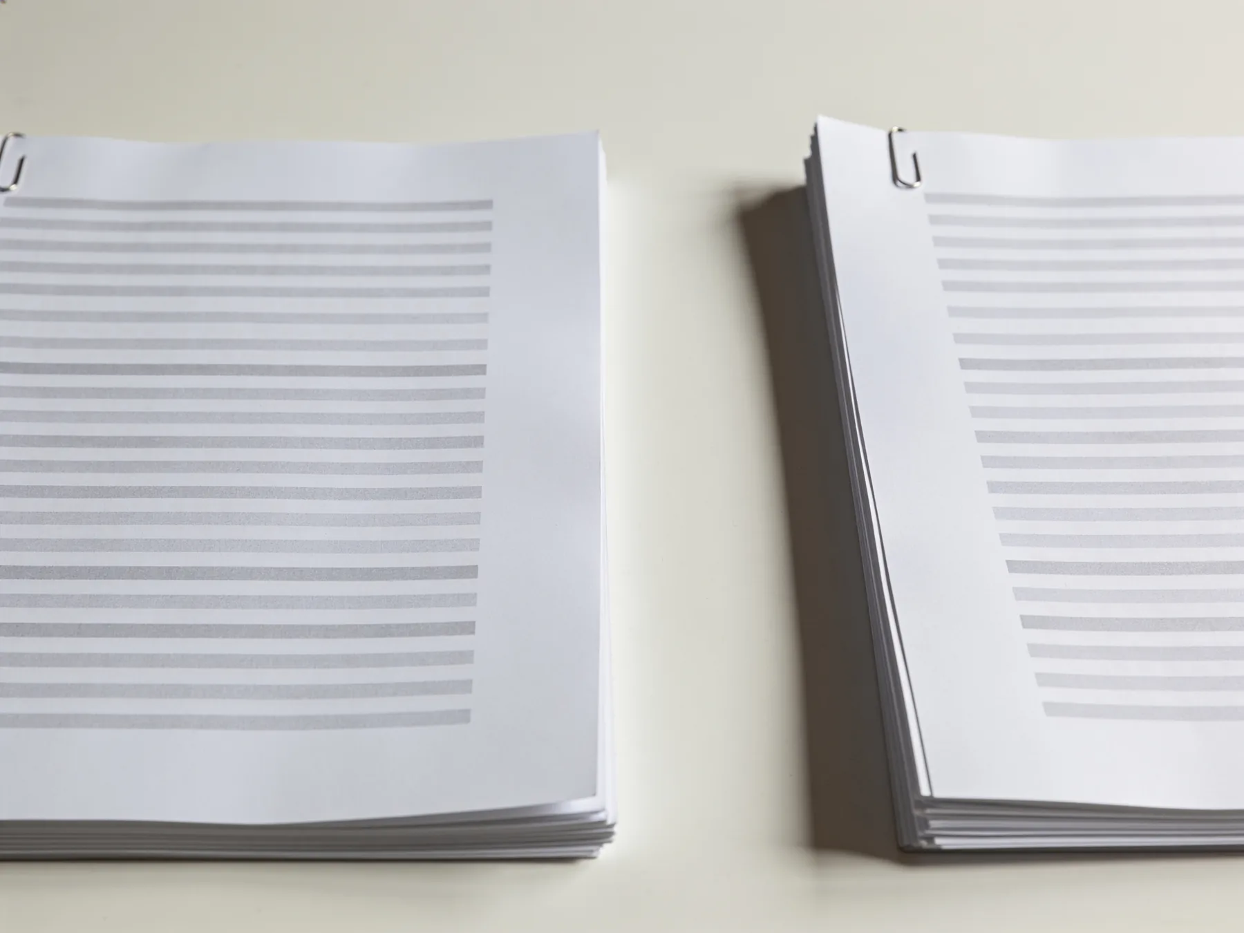 Two similar printed documents side by side on a desk